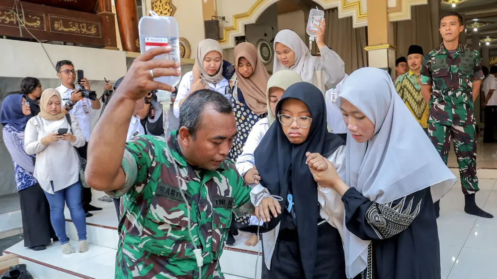 Food poisoning incidents linked to Indonesia's free meal programme affect thousands