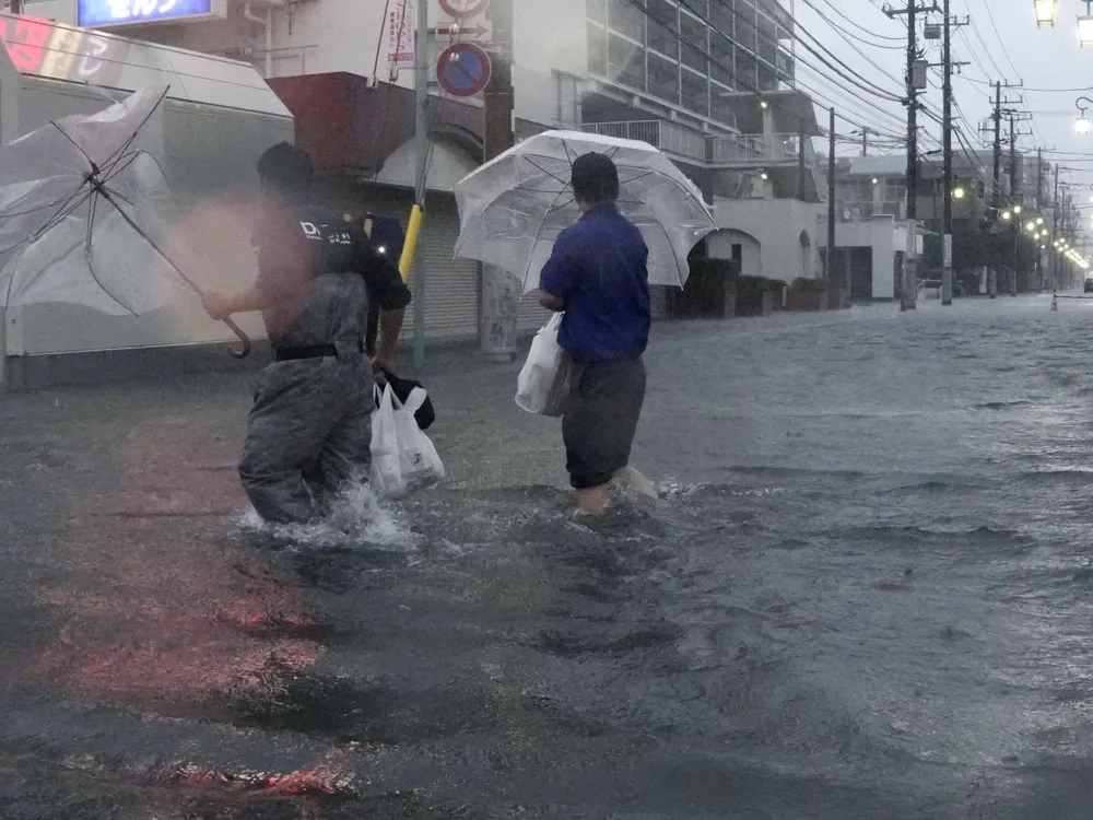 Typhoon Dujuan Causes Devastation and Evacuations in Japan