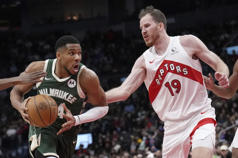 Antetokounmpo stitches up finger, then achieves triple-double against Raptors