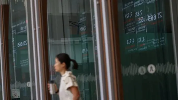 Asian shares make cautious gains amid Treasury support following U.S. tax bill passage