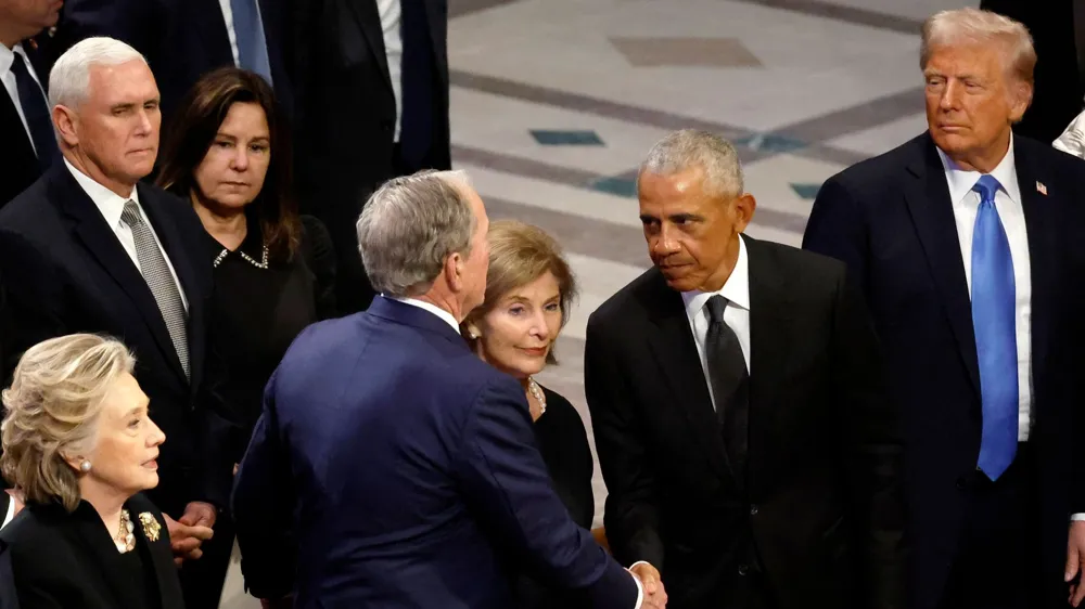 Barack Obama and George W. Bush's Lighthearted Moment at Funeral Goes Viral