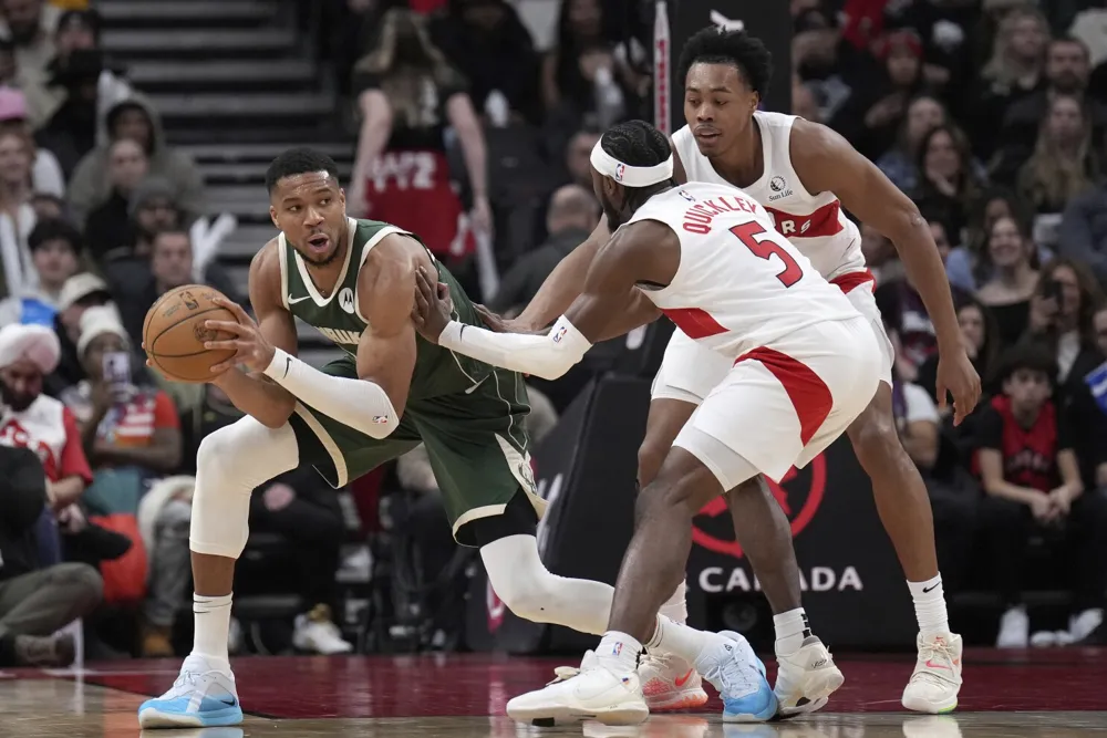 Bucks Dominate Raptors 128-104 with Antetokounmpo's Triple-Double and Lillard's 25 Points