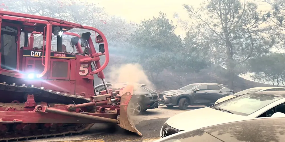 Bulldozer Clears Abandoned Cars Amid Los Angeles Fires