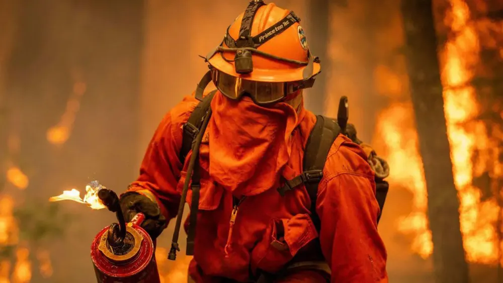 Incarcerated Firefighters Tackle California Wildfires Amidst Controversy and Stigma