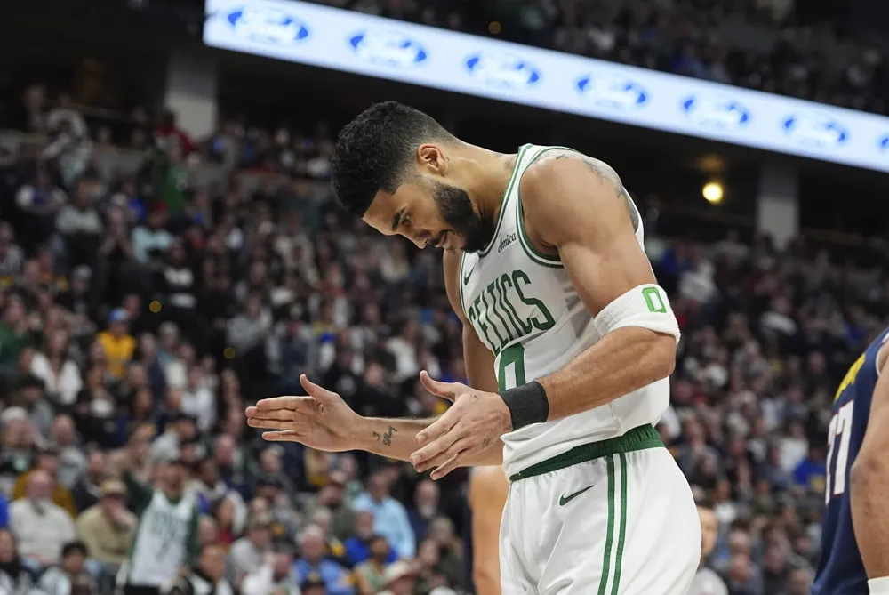 Celtics Defeat Injury-Plagued Nuggets 118-106 with Tatum and Porzingis Leading the Way