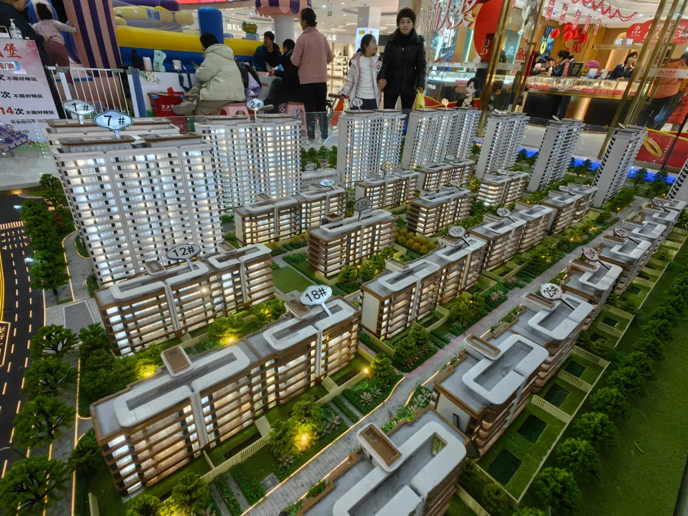 Chinese property developers face continued debt challenges in 2025 despite potential regulatory support