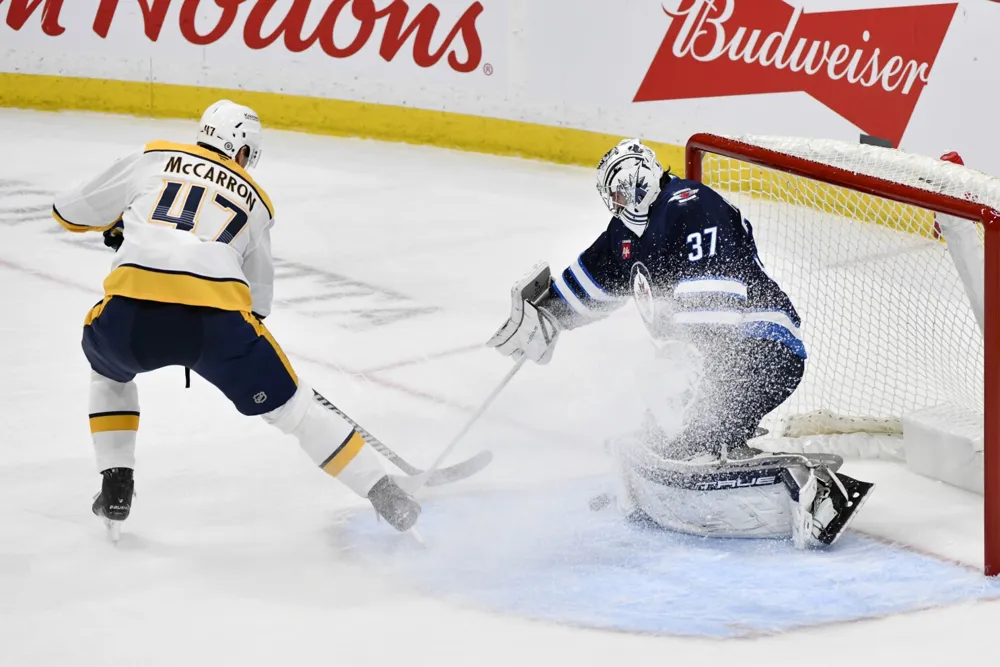 Connor Hellebuyck achieves 300th win in Jets' 5-2 victory over Predators