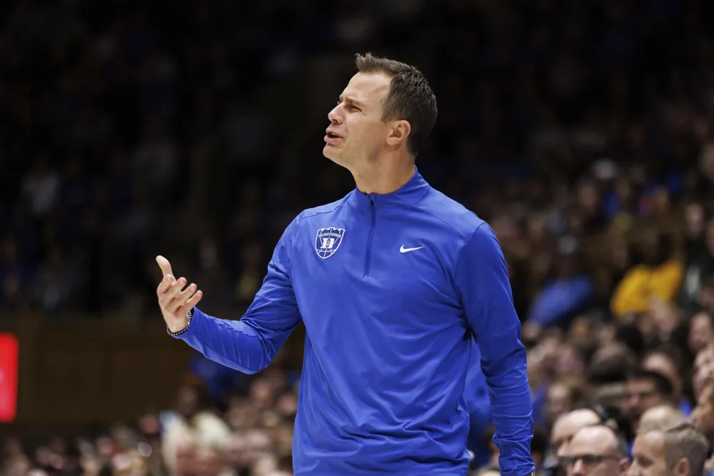 Duke's Coach Jon Scheyer Reflects on 'Bizarre' Experience Watching Game from Home Due to Illness