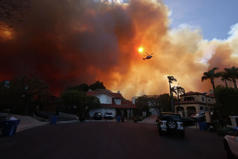 Fast-moving Palisades Fire prompts urgent evacuations in Los Angeles