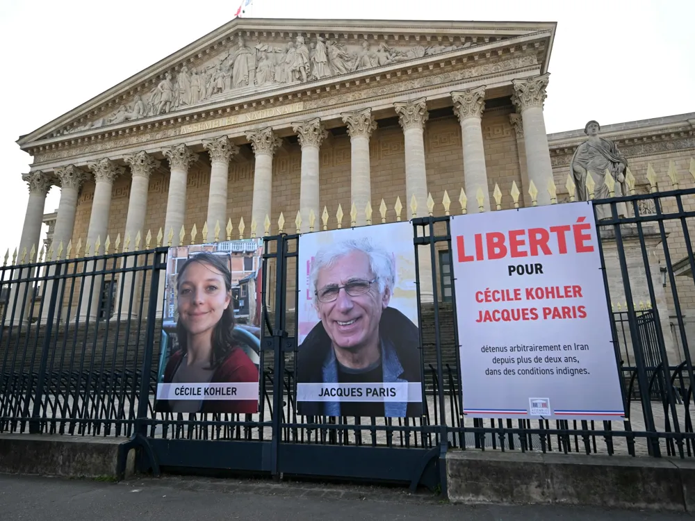 French Hostages Cécile Kohler and Jacques Paris Released from Iran, Returning Home