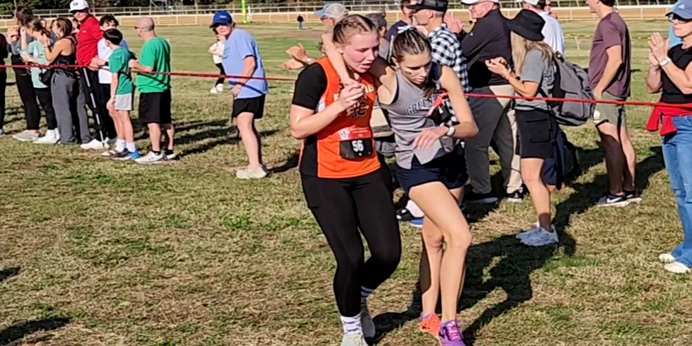 High school runner chooses kindness, helps rival in final race moment