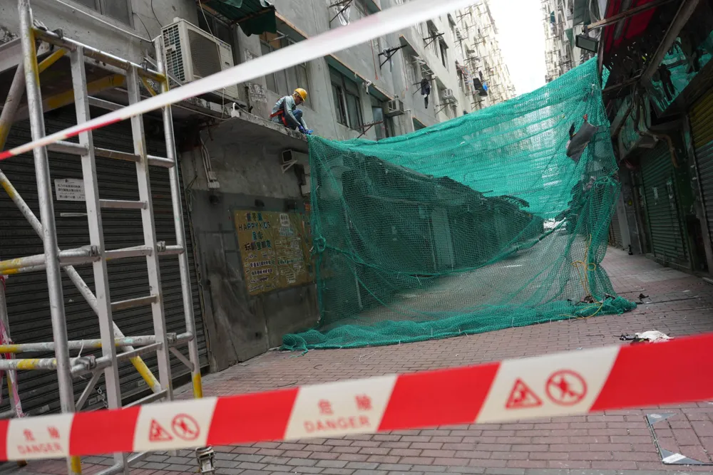 Hong Kong mandates scaffolding net removal across buildings post-deadly blaze
