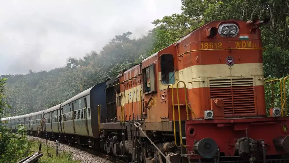 Incredible survival as woman lies on railway tracks while train passes by