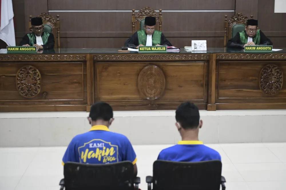 Indonesian court issues public caning sentences for two men engaged in homosexual acts