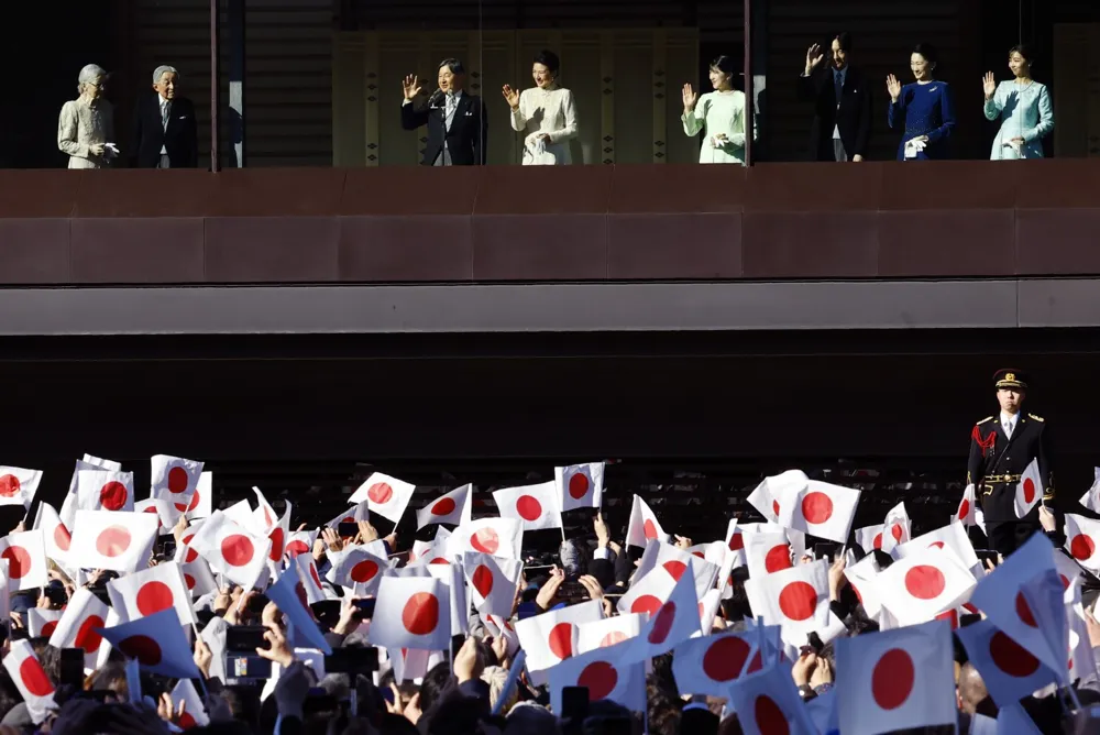 Japanese Emperor and Family Celebrate New Year with Flag-Waving Crowd at Imperial Palace