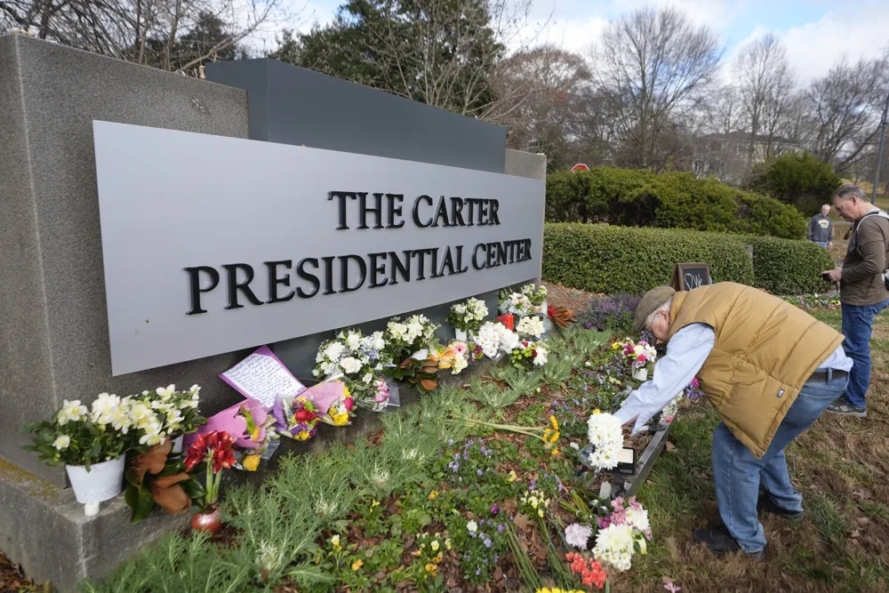 Mourners Pay Tribute to Jimmy Carter as His State Funeral Procession Begins