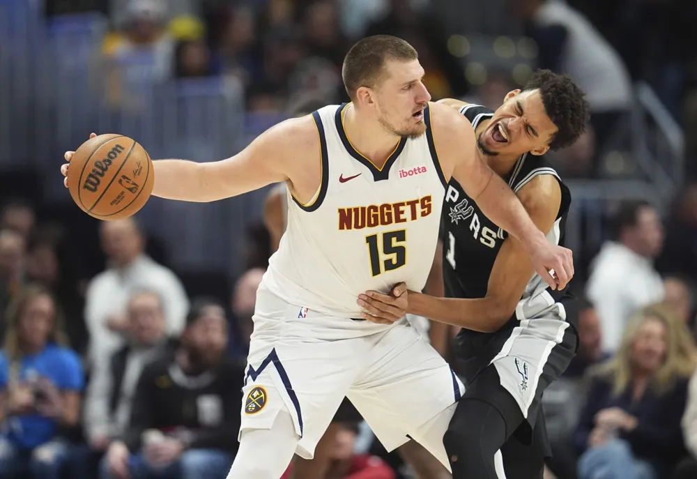 Jokic leads Nuggets to overtime victory against Spurs, marking Wembanyama’s birthday