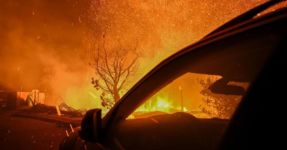 Los Angeles Firefighters Contain Wildfires Amid Escalating Warnings