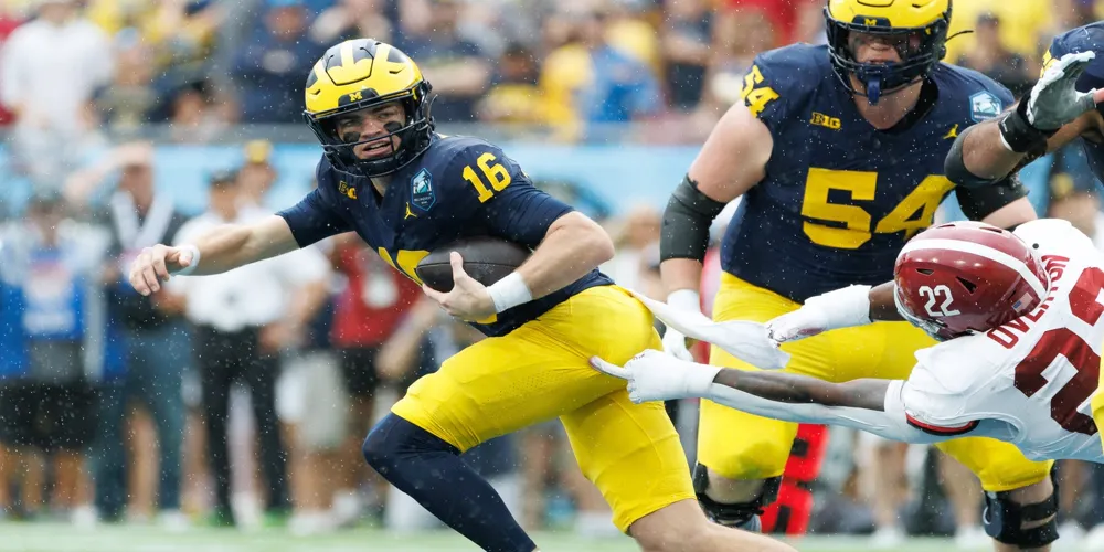 Michigan QB Davis Warren suffers torn ACL, vows to return in 2025