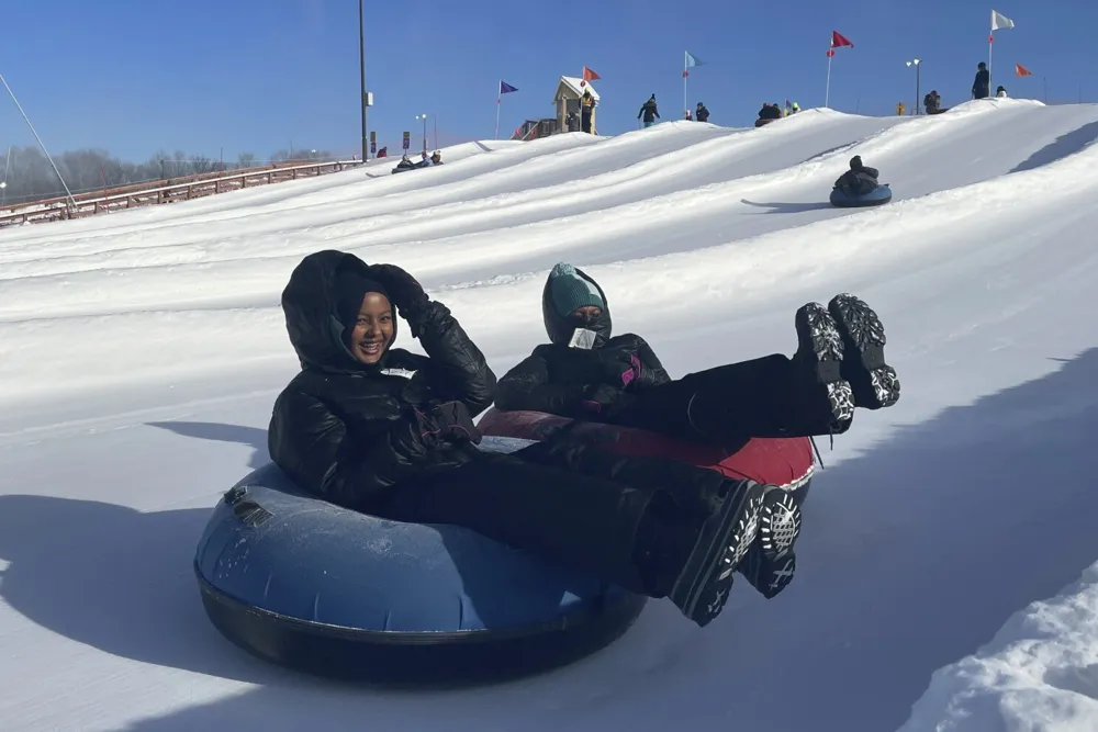 Minnesota Muslim Women's Group Enjoys Snow Tubing Amid Hijab Challenges