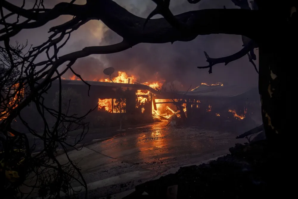 Pacific Palisades Wildfire Forces Evacuations as Flames Threaten Celebrity Neighborhood