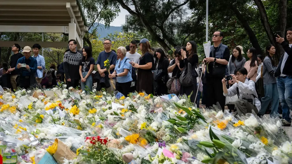 Public Anger Grows Over Hong Kong Fire as National Security Police Detain Activist