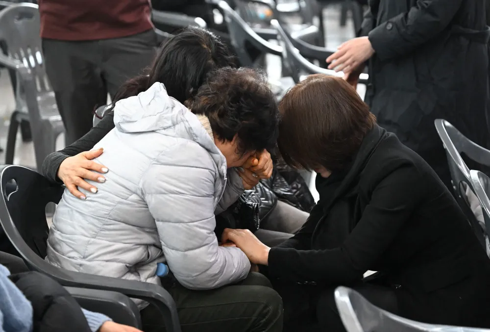 Sorrow and prayer fill South Korean airport as families mourn tragic plane crash victims