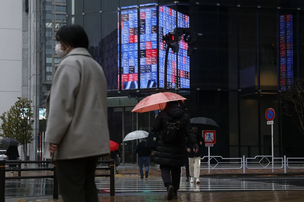 Stocks Slide in Asia Following US Market Trend Amid Inflation Concerns