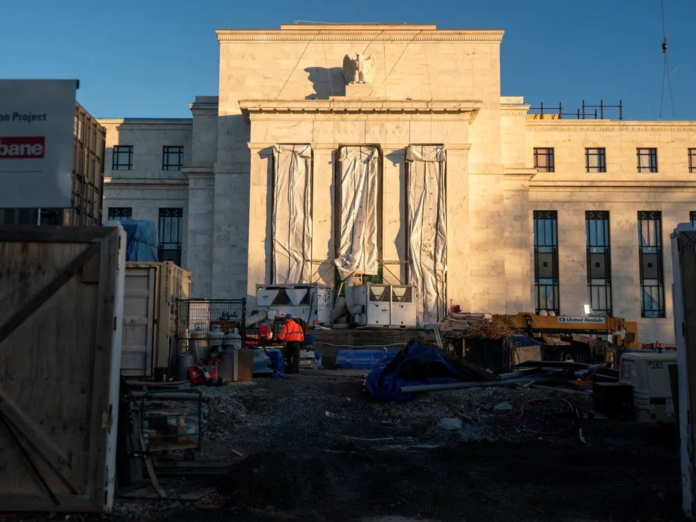 Federal Reserve holds interest rates steady amid political pressures from Trump