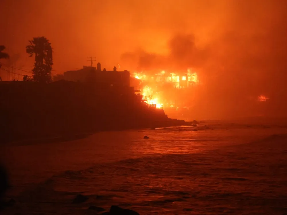 Wildfires in Los Angeles threaten neighborhoods with escalating damages